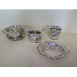 A silver twin handled bowl on stand, a silver jug, a silver leaf dish and a silver tumbler - total