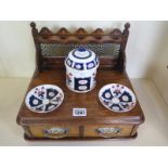 An oak smokers box with ceramic tobacco pot and dishes - 24cm H x 30cm x 24cm - dishes have been