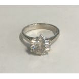 An impressive solitaire diamond ring - 3.19ct, white gold, size M - round brilliant cut, colour