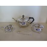 A silver three piece tea service, with associated nips, Sheffield 1911 and 1912, approx total 29