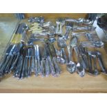 A collection of assorted plated cutlery including Kings pattern and six silver handled butter knives