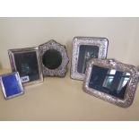 A selection of five silver photo frames - from 8cm x 7cm to 19cm x 15cm