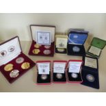 A collection silver proof late 20th century British coins, a Victoria anniversary crown, a Queen