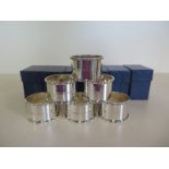 A set of six unused un-engraved silver napkin rings- boxed - total weight approx 4.5 troy oz