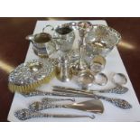 A collection of various silverwares, two silver milk jugs, a sugar bowl, four napkin rings,