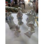 Five Lladro figurines, including a group of a bride and groom, largest 25cm high, two of the