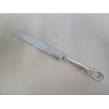 A Tiffany & Co silver handled cake knife - 28cm long - good condition