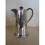 A silver water jug, Walker and Hall, Sheffield 1927, approx 17.4 troy oz, denting to body, otherwise