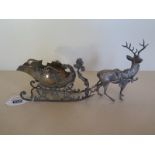 A continental silver sauceboat in the form of a sleigh with white metal reindeer attachment,