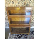 A three section Globe Wernicke bookcase, with label to back, approximately 121 cm high, 85 cm