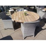 A Bramblecrest Kuta teak garden table and four Rattan chairs with cushions