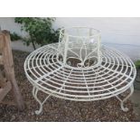 A painted cream iron circular tree seat - 136cm diameter