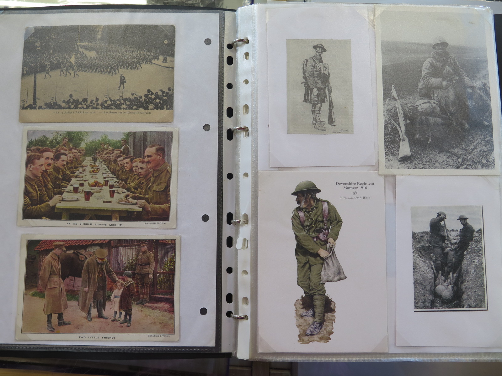 An album of approx 200 WWI postcards and cuttings