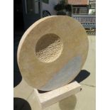 A hand carved limestone abstract garden sculpture