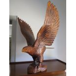 A carved wooden eagle - 62cm H