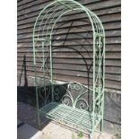 A painted garden iron arch with a sea