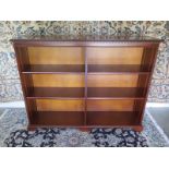 A 20th Century modern double open bookcase with adjustable shelves - 106cm H x 138cm x 31cm - in