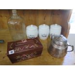 Three ceramic containers, a tea pot, glass bottle and a decorated tea caddy