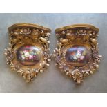 A pair of ornate gilt floral decorated wall brackets - 51cm H x 40cm W