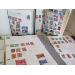 A collection of stamps predominantly British ranging from the late 19th century the 20th century,