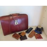 Eight gentleman's leather items to include a large attache case - two wallets, two cigar cases and a