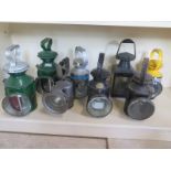 Eight vintage railway lanterns, including or marked LNEE Loco Stratford 2351 and another bearing