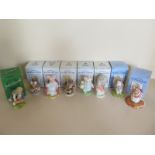 Eight Beatrix Potter figurines by Royal Albert, Royal Doulton and one by Beswick, including Little