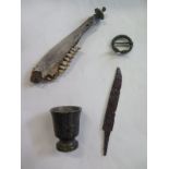 A group of four interesting antiquities to include a brooch, dagger blase, jaw and bronze mortar -