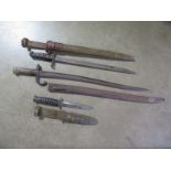 Two Bayonets and a fighting knife, to include an American 1917 Bayonet with scabbard, blade length