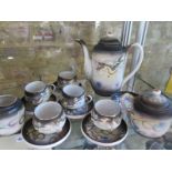 A Japanese tea set with a teapot cups, 5 teacups, 6 saucers, a milk jug and a lidded sugar bowl, see