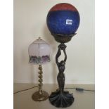 An Art Nouveau style bronze table lamp and shade together with an earlier spiral brass lamp and