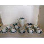 A Susie Cooper green banded coffee set with coffee pot, milk jug, sugar bowl and nine coffee cans