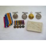 A group of four WWI and WWII medals with miniatures, WWI medals named to 51550 Pte WL Smith, Worc R,