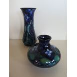 A Moorcroft vase, approximately 20.5cm high, and posie holder, approximately 13cm diameter, both