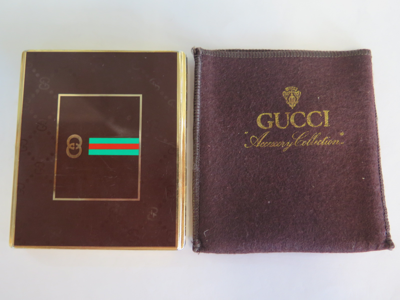 A Gucci Accessory Collection cigarette case and cover, some usage marks, generally good