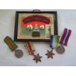 A group of four WWII medals unnamed, and framed items with plaque to Pte AW Johnson 13112314