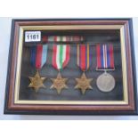 A framed group of four WWII medals