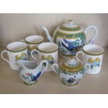 A Hermes of Paris tea set and four mugs, design Toucan, chips to spout, rest good condition