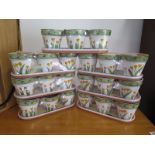 Twenty-one decorated flower pots 9cm H, with trays, in sets of three