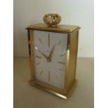 A Saint Blaise gilt metal mantle clock, manual wind in clean running condition - 14cm x 9cm