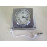 A chrome bulkhead clock by Asprey, 8 day platform movement - 10cm x 12cm - running but missing