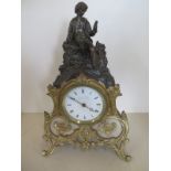 A French spelter and gilded mantle clock, 8 day tic tac movement, case decorated with a figure of