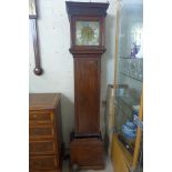 A Will Peacock Kimbolton 30 hour long case clock with a brass dial and birdcage movement, with a