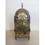 A brass lantern clock with an English balance movement - 33cm tall, running in saleroom