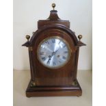 A mahogany case 8 day mantle clock, strikes hours and half