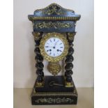 An ebonised French Portico clock with gilt decoration - 8 day movement, strikes on bell - 50cm tall