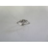 A platinum three stone diamond ring - size P - approx weight 2.7 grams - some usage but generally
