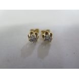 A pair of 18ct gold diamond earrings, each diamond approx 0.35ct, approx 2 grams - diamonds bright