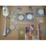 A silver spoon approx 2.2 troy oz, a souvenir spoon and assorted coins