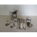 A silver cream jug, six silver handle knives, a silver top, assorted silver and white metal